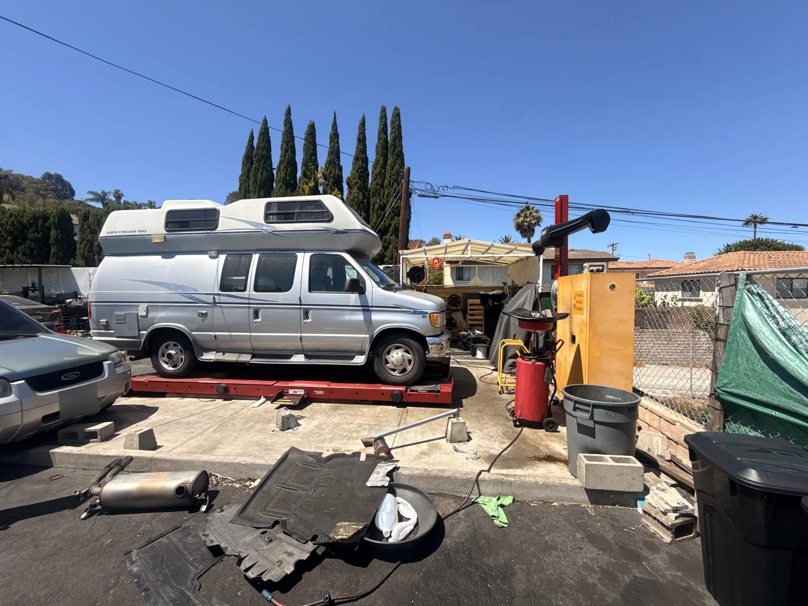 Side view of a silver camper van on the service platform at Hillside.