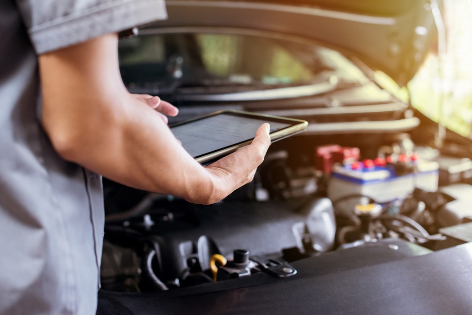 Technician running diagnostics on a tablet