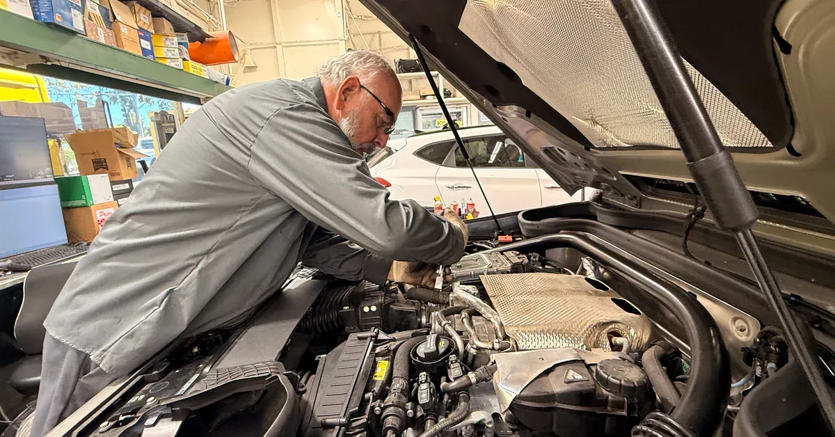 Hillside technician working at an engine bay